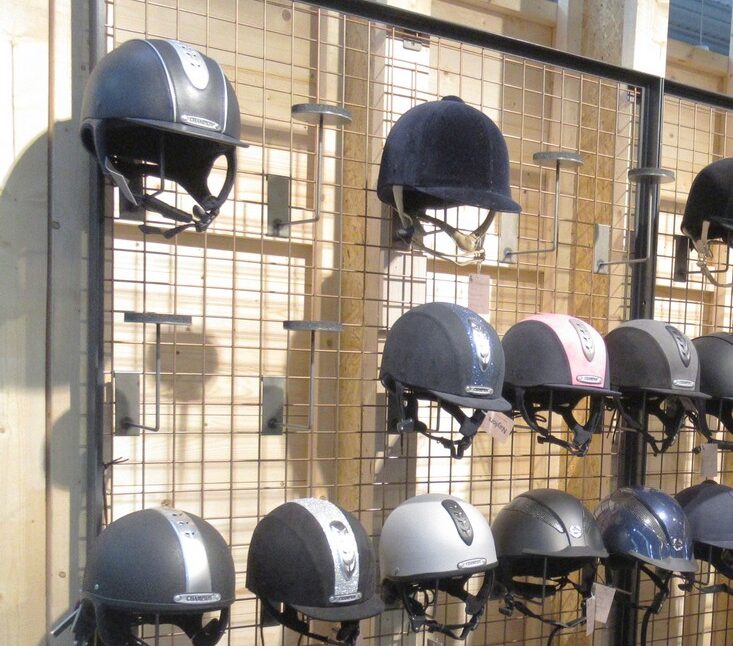Equestrian shop-fittings - Riding hats on mesh